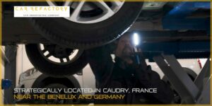 Vehicle refurbishment technician inspecting car undercarriage during comprehensive mechanical assessment