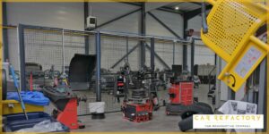 Dedicated wheel refurbishment area with specialized equipment at Car Refactory's vehicle reconditioning center