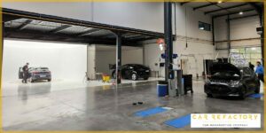 Professional photography studio for refurbished vehicles with car positioned for marketing photos at Car Refactory