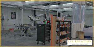 Car Refactory's dedicated paint preparation workspace with professional equipment for vehicle refurbishment